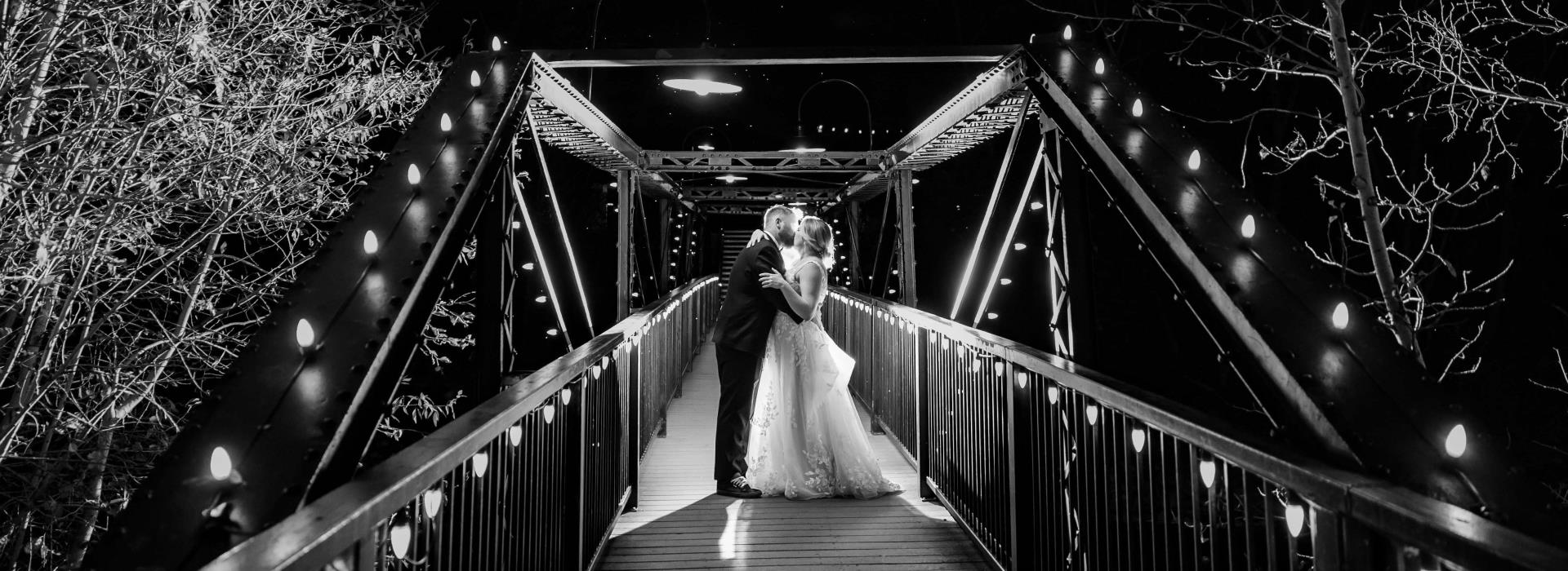 bride and groom on bridge